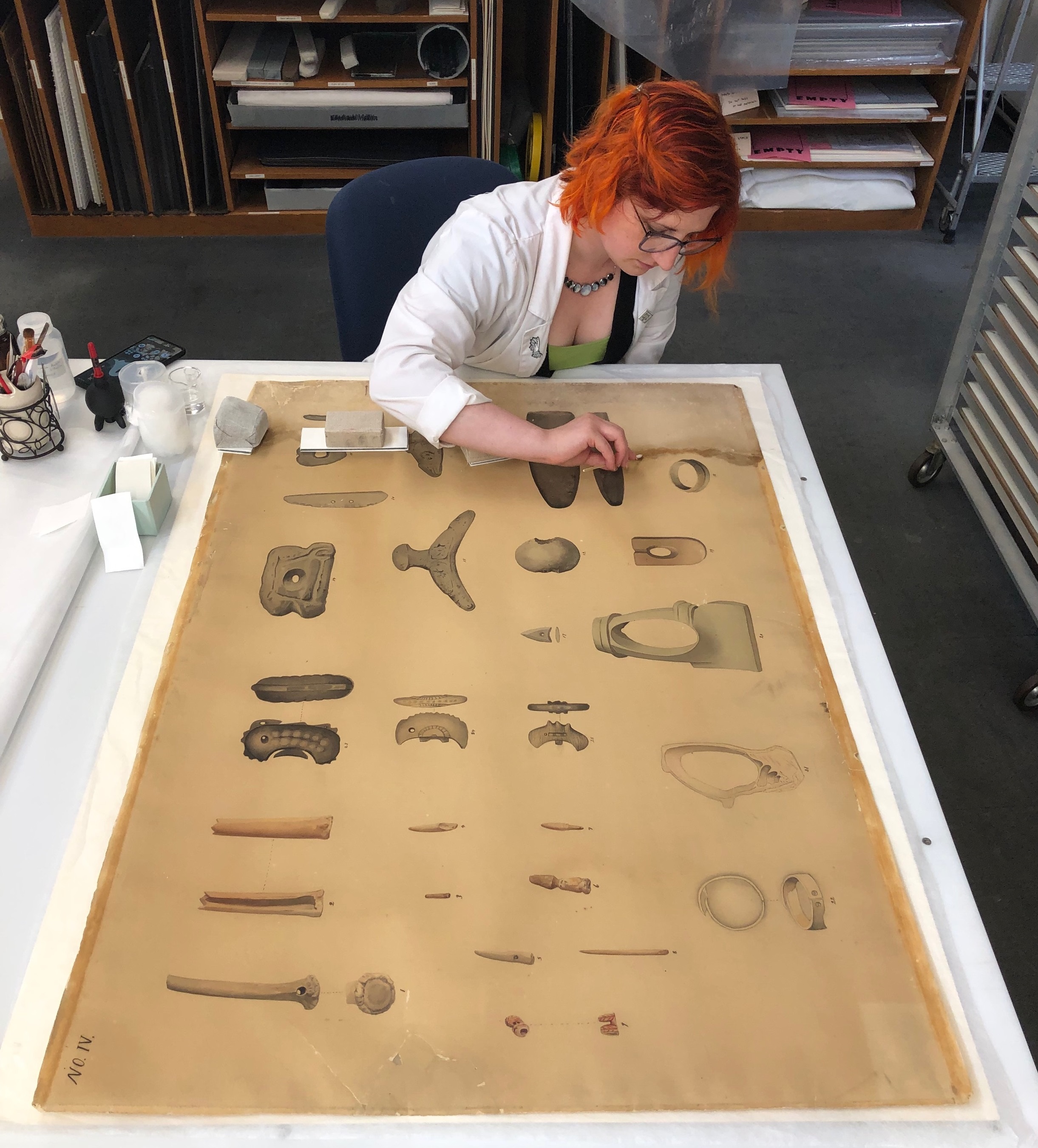 CCAHA Associate Conservator Joanna Hurd works on an 1893 Japanese watercolor from the Penn Museum's collections