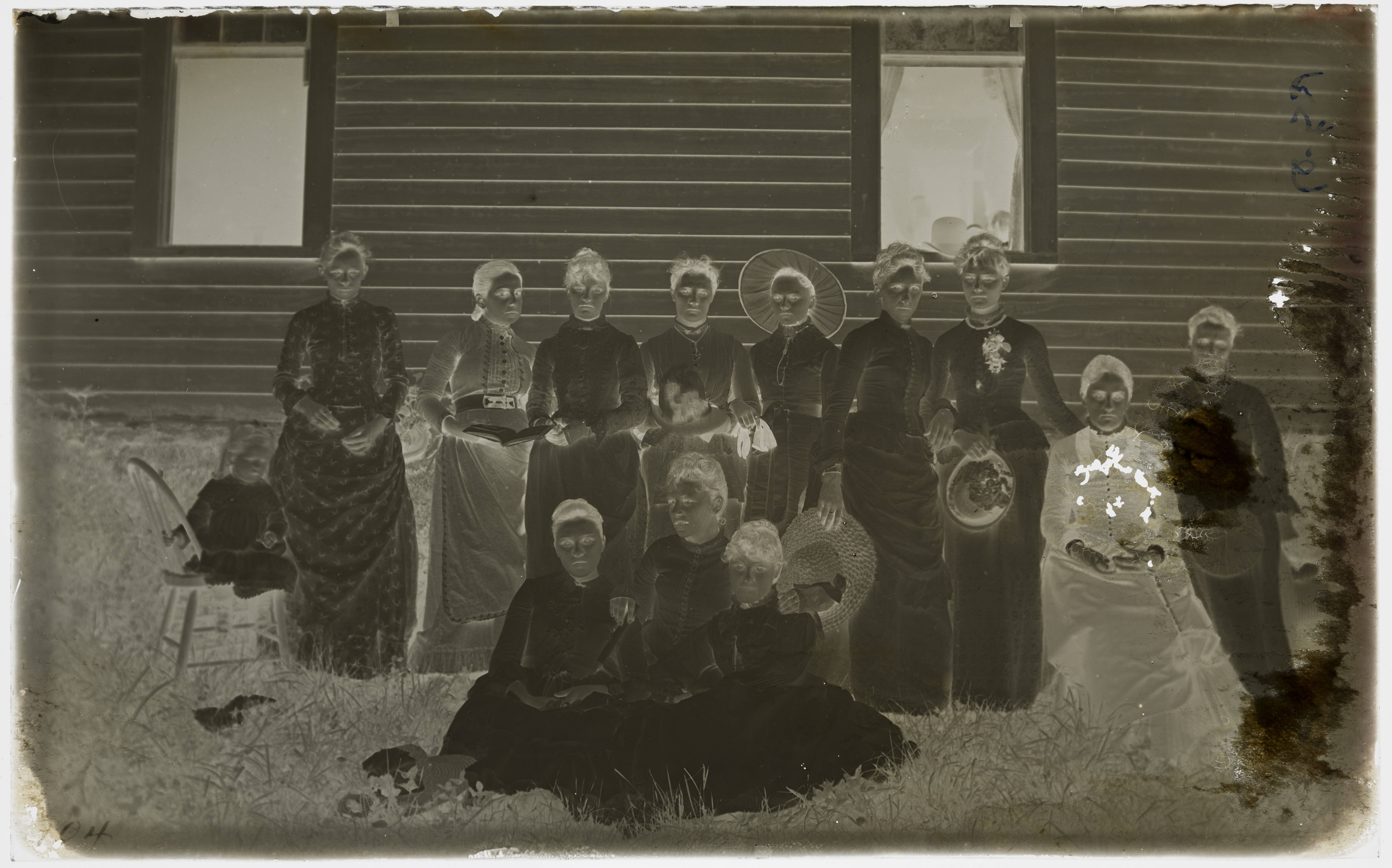 A glass plate negative of a group portrait by O.G. Felland.