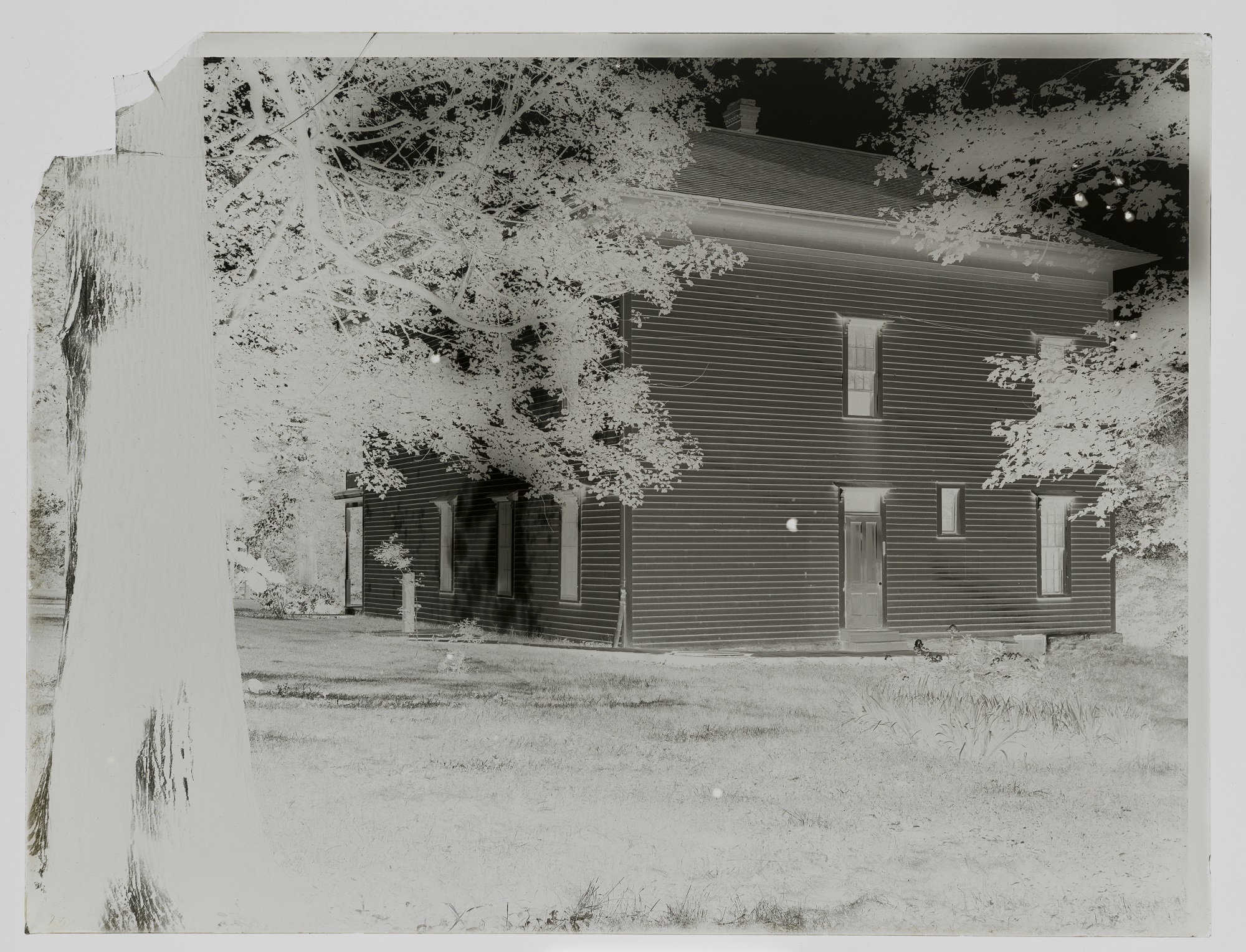 A glass plate negative of a St. Olaf campus building by O.G. Felland.