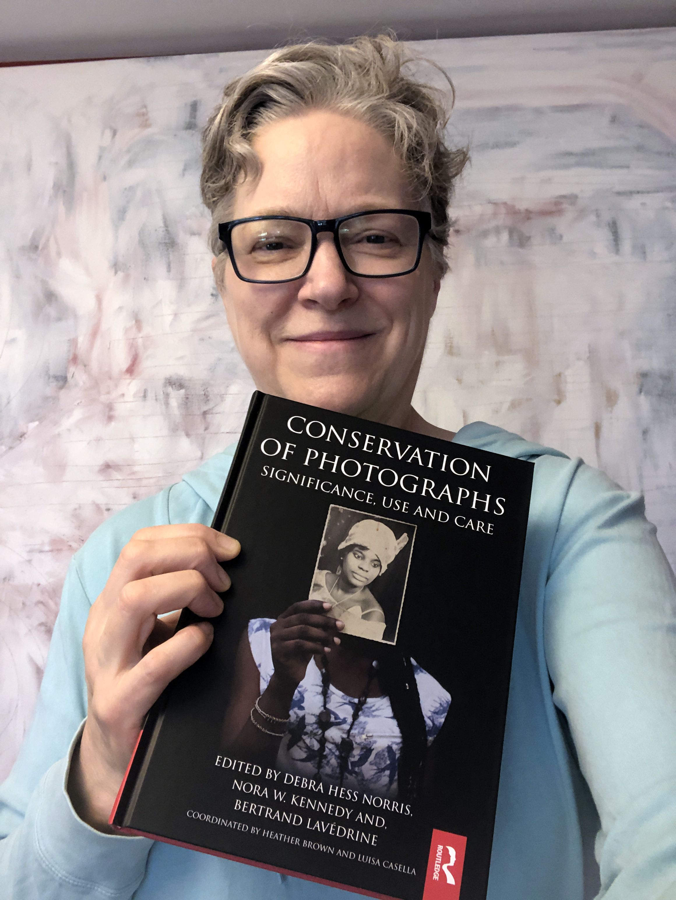 Barbara poses with new Photo Conservation book.