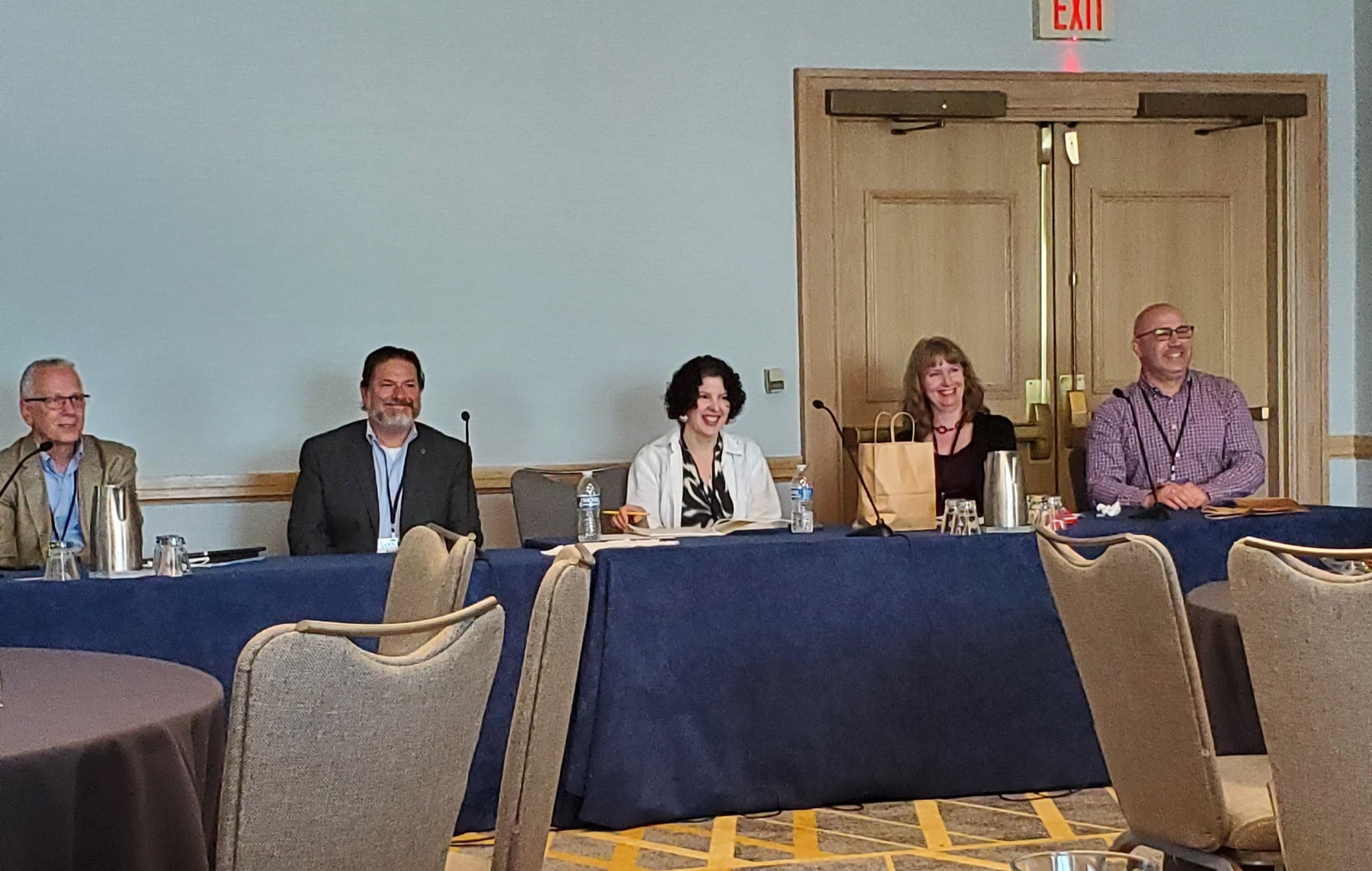 Jessica Silverman, in the center with a white jacket, presents at AIC 2023 in Jacksonville.