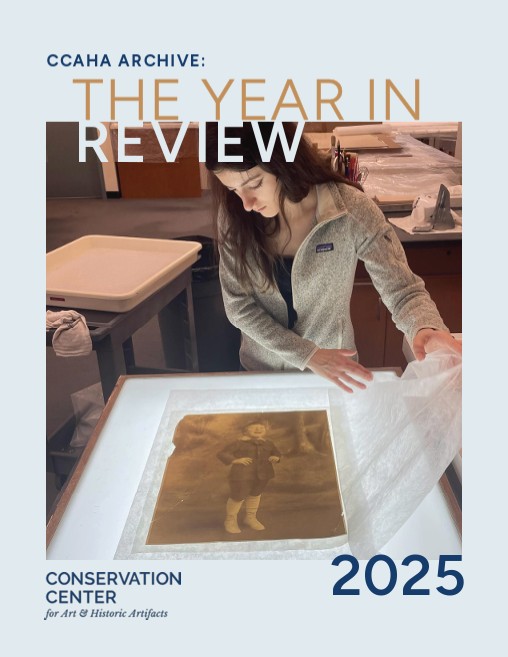 The cover of the CCAHA Year in Review 2025. Matilde Ticci uses a light table to observe an artifact.