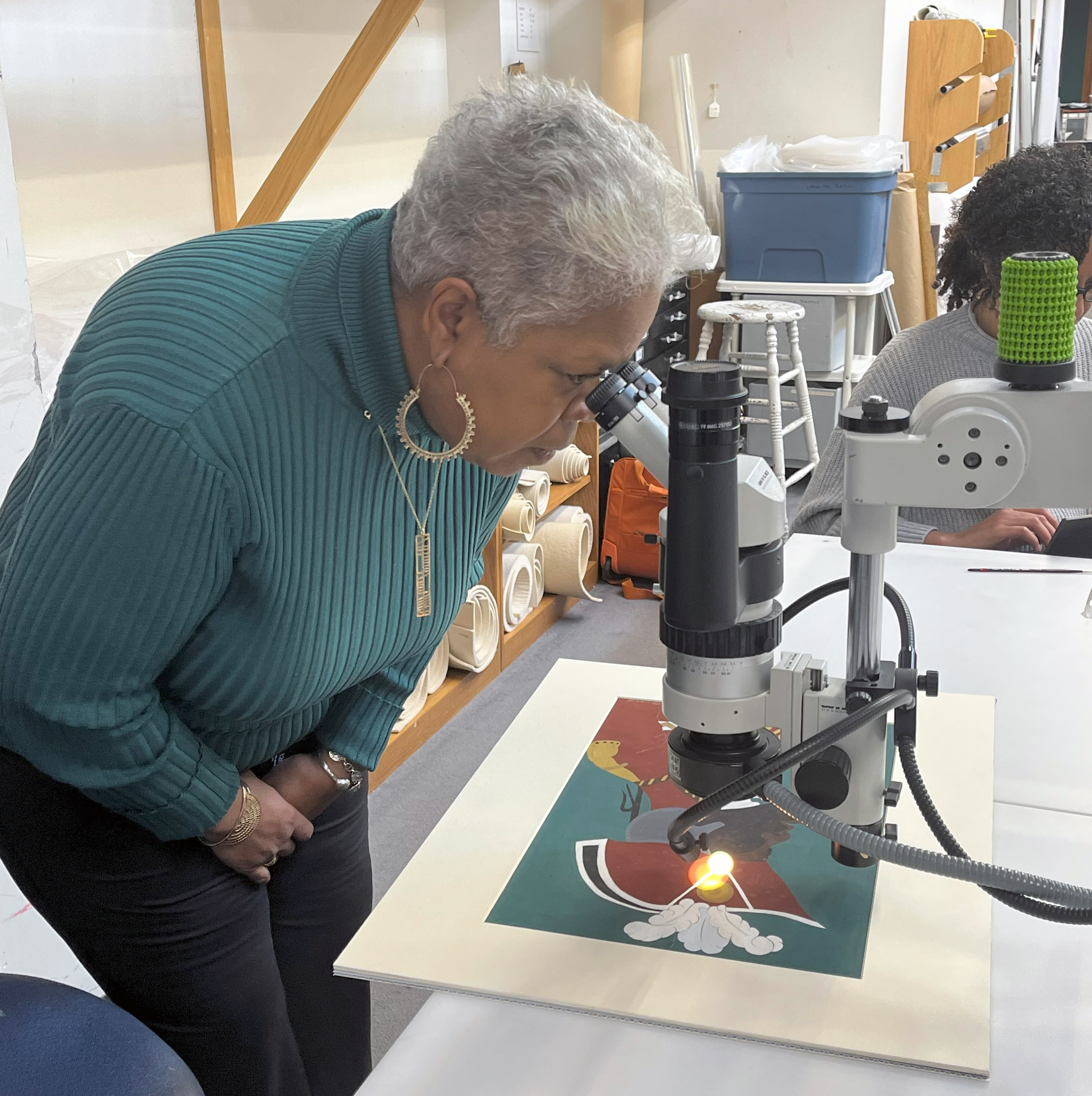 Amistad's Kathe Hambrick takes a closer look through the microscope