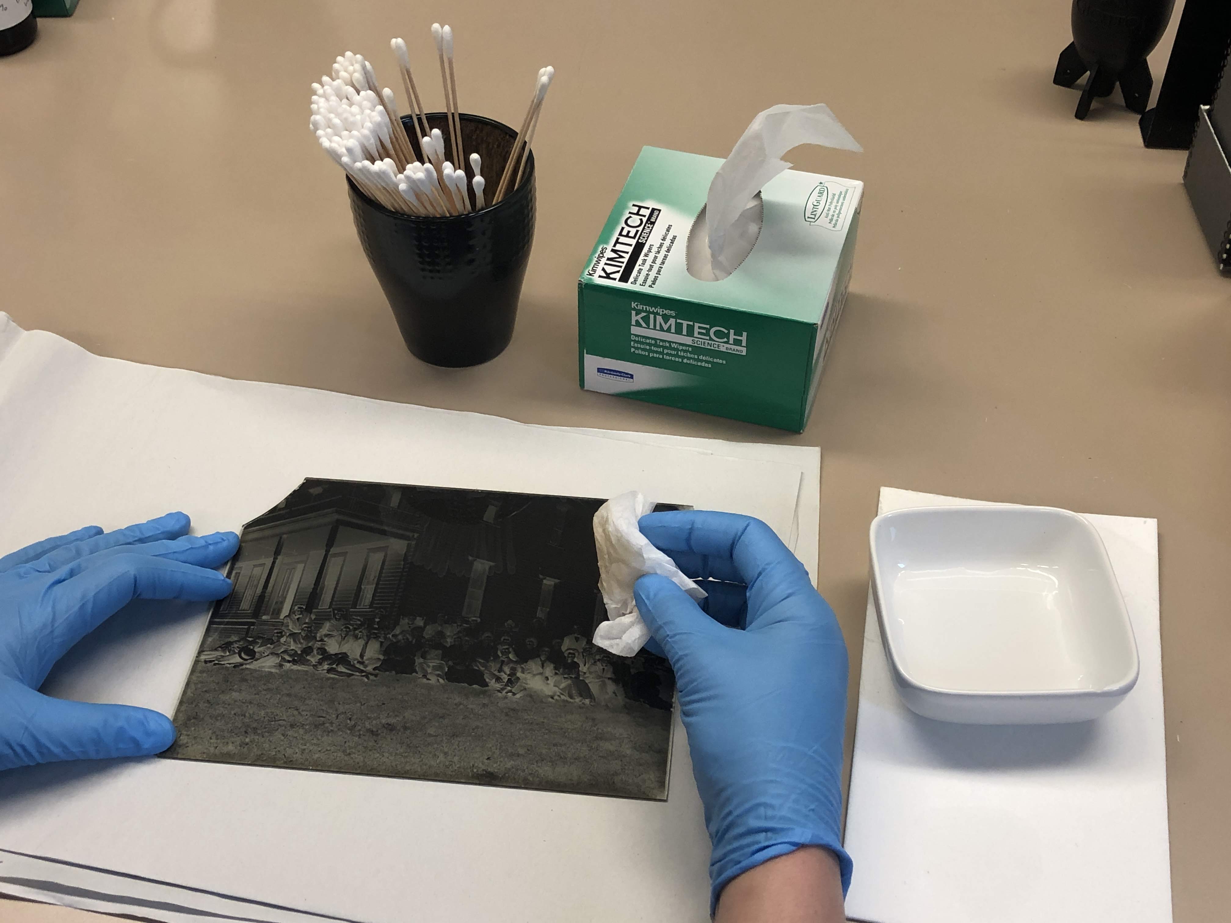 CCAHA staff preparing a negative for shipment