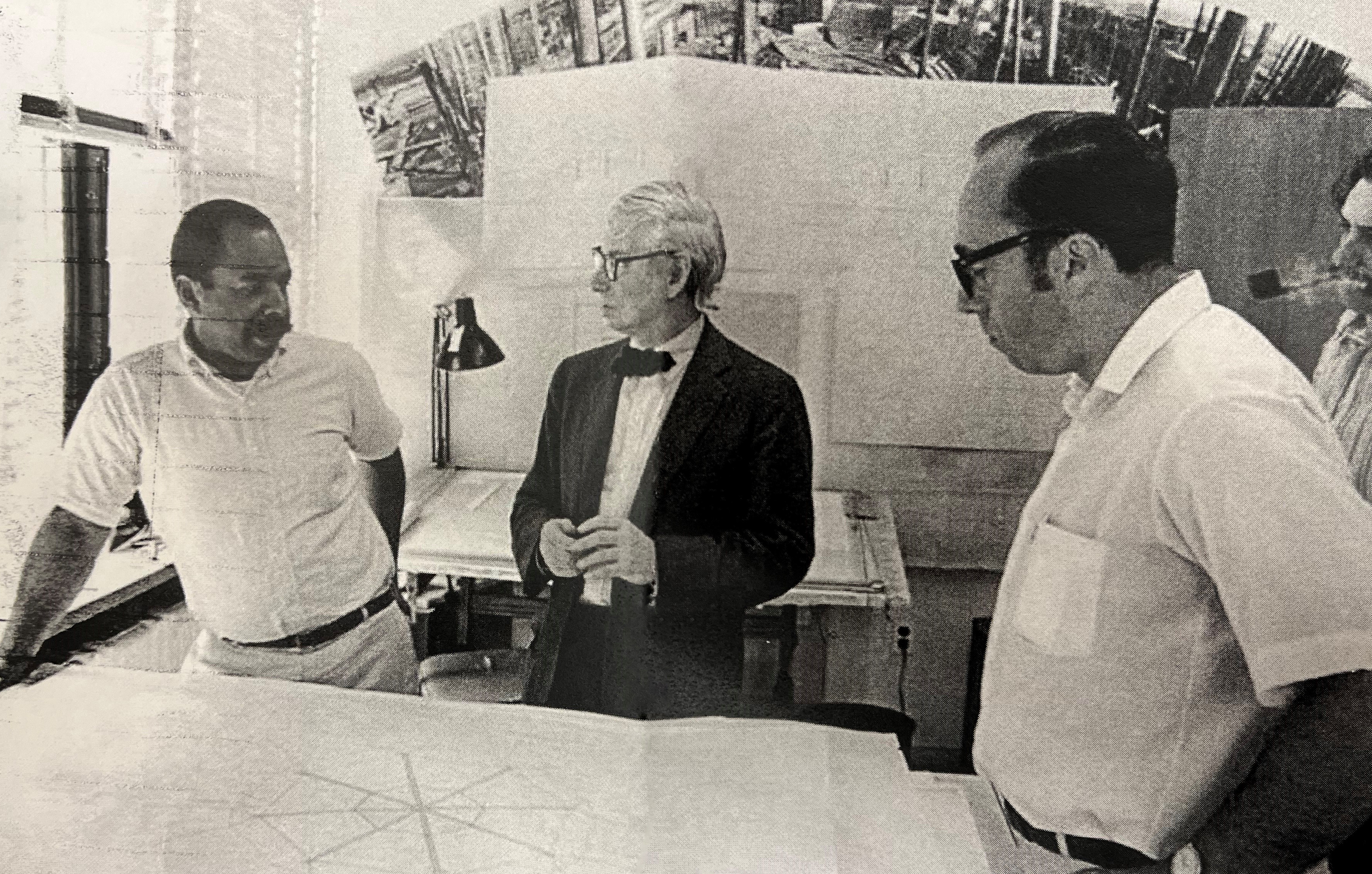 Copy of a snapshot of Kahn and staff circa 1969 with panorama in background