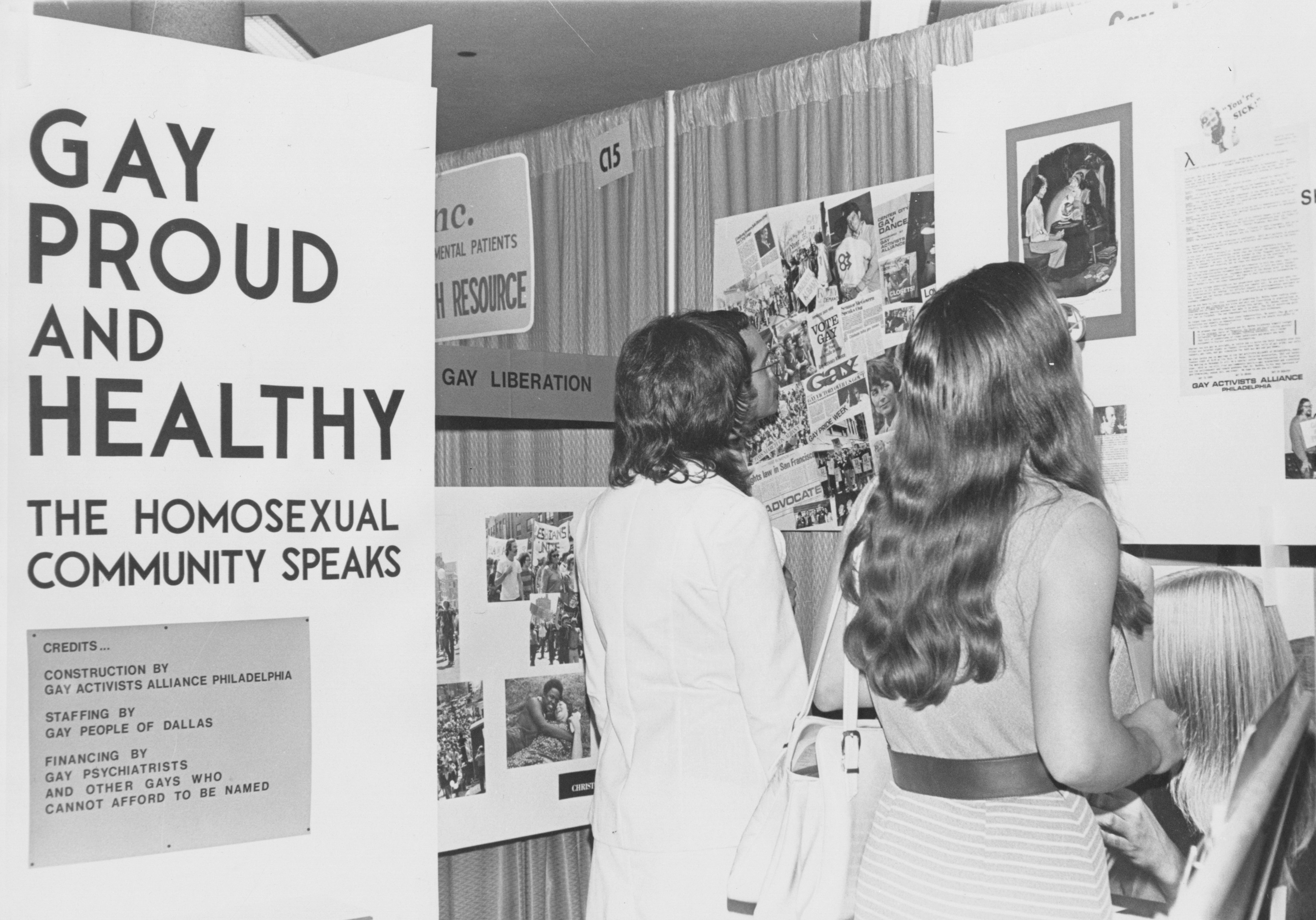 People looking Barbara Gittings' displays c. 1970s