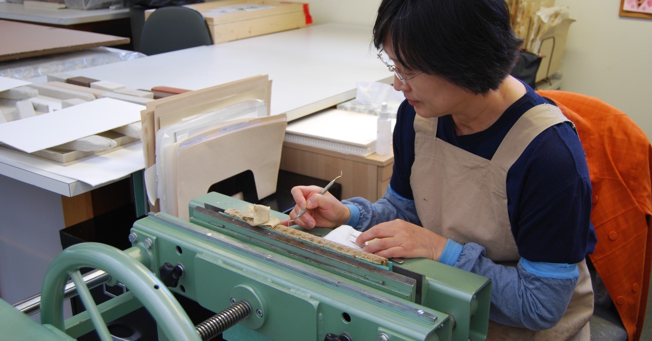 Woman at book press