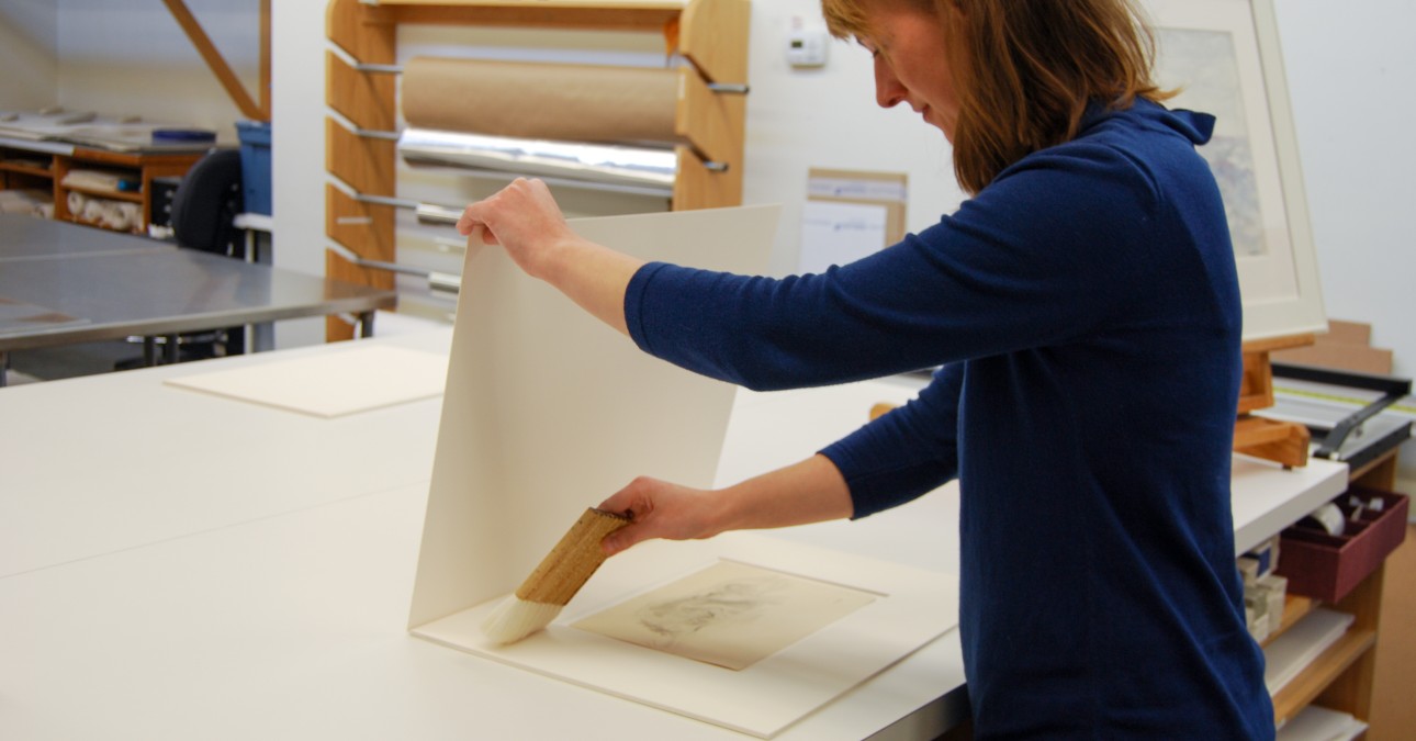 Technician cleaning a matted object