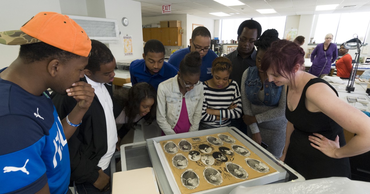 HBCU students examine photographs