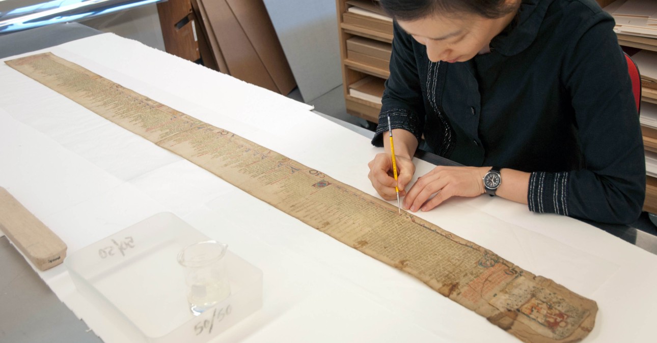 Conservator treats long scroll