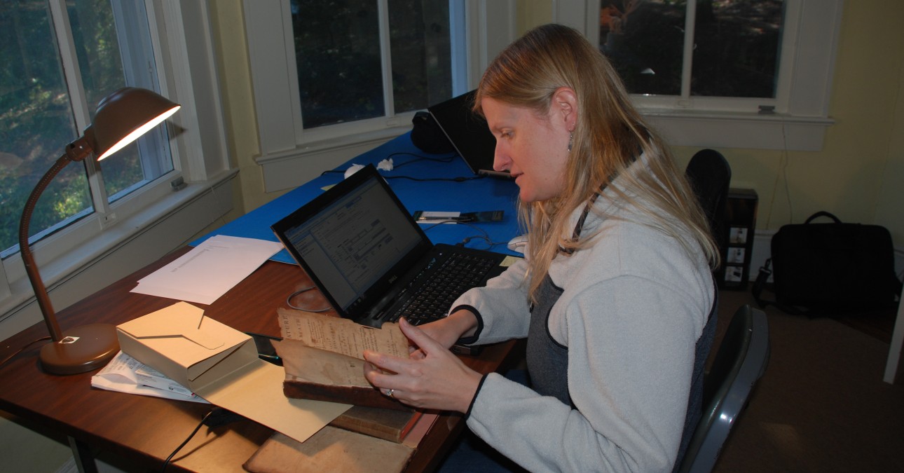 Conservator assessing a volume