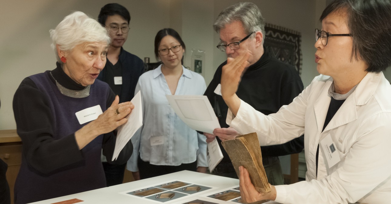Book Conservator Theresa Cho talks to guests at the 2019 Open House