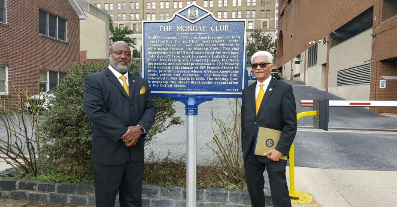 David Jones, President of the Monday Club and Vincent Robinson, Financial Secretary of The Monday Club alongside the organization's historical marker