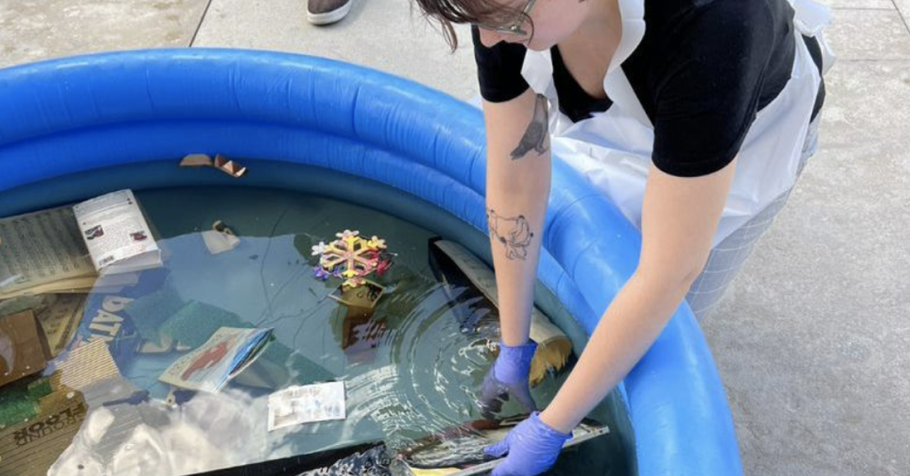 A participant practices salvaging a study collection of objects from a pool of water at a training held earlier this month at the Barnes Foundation in Philadelphia.