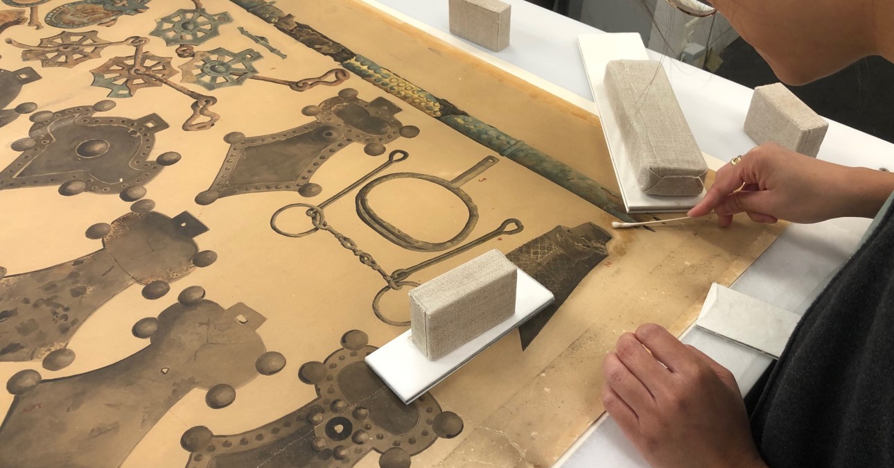 CCAHA Conservation Technician Binh-An Nguyen works on an 1893 Japanese watercolor from the Penn Museum's collections