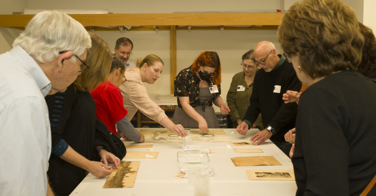 Group of people involved in a hands-on demonstration at the CCAHA Open House