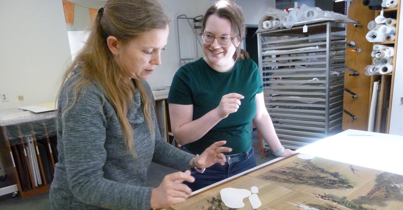 Senior Paper Conservator Heather Hendry (left) discusses treatment with CCAHA Mellon Paper Conservation Fellow Sandrine Blais