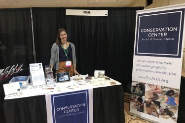 DHPSNY Program Manager Anastasia Matijkiw poses at the CCAHA exhibit table during last month's AASLH Annual Meeting in Philadelphia
