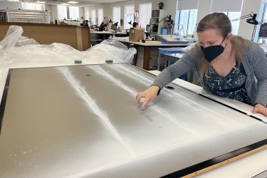 CCAHA Senior Paper Conservator Heather Hendry examines the iconic Waterfall mural of artist Hiroshi Senju from Philadelphia’s Shofuso Japanese Cultural Center