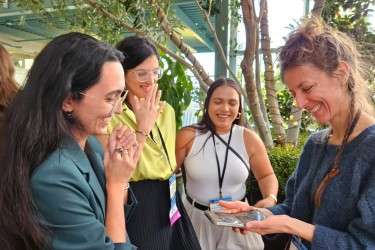 A group of CCAHA and CENCOR's Preventive Conservation Fellows meeting with CCAHA Book Conservator Amber Hares at AIC 2024.