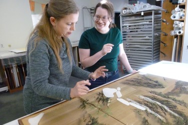 Senior Paper Conservator Heather Hendry (left) discusses treatment with CCAHA Mellon Paper Conservation Fellow Sandrine Blais