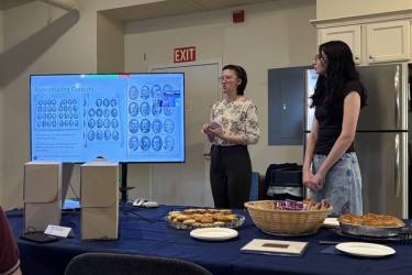 Terra and Sophia present in front of a tv screen about their co-op experience.
